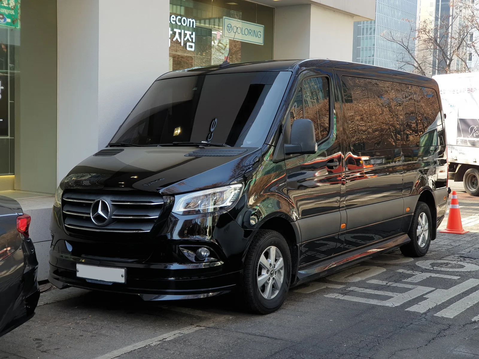Black Mercedes-Benz Sprinter Tourer, representative full front three-quarter exterior